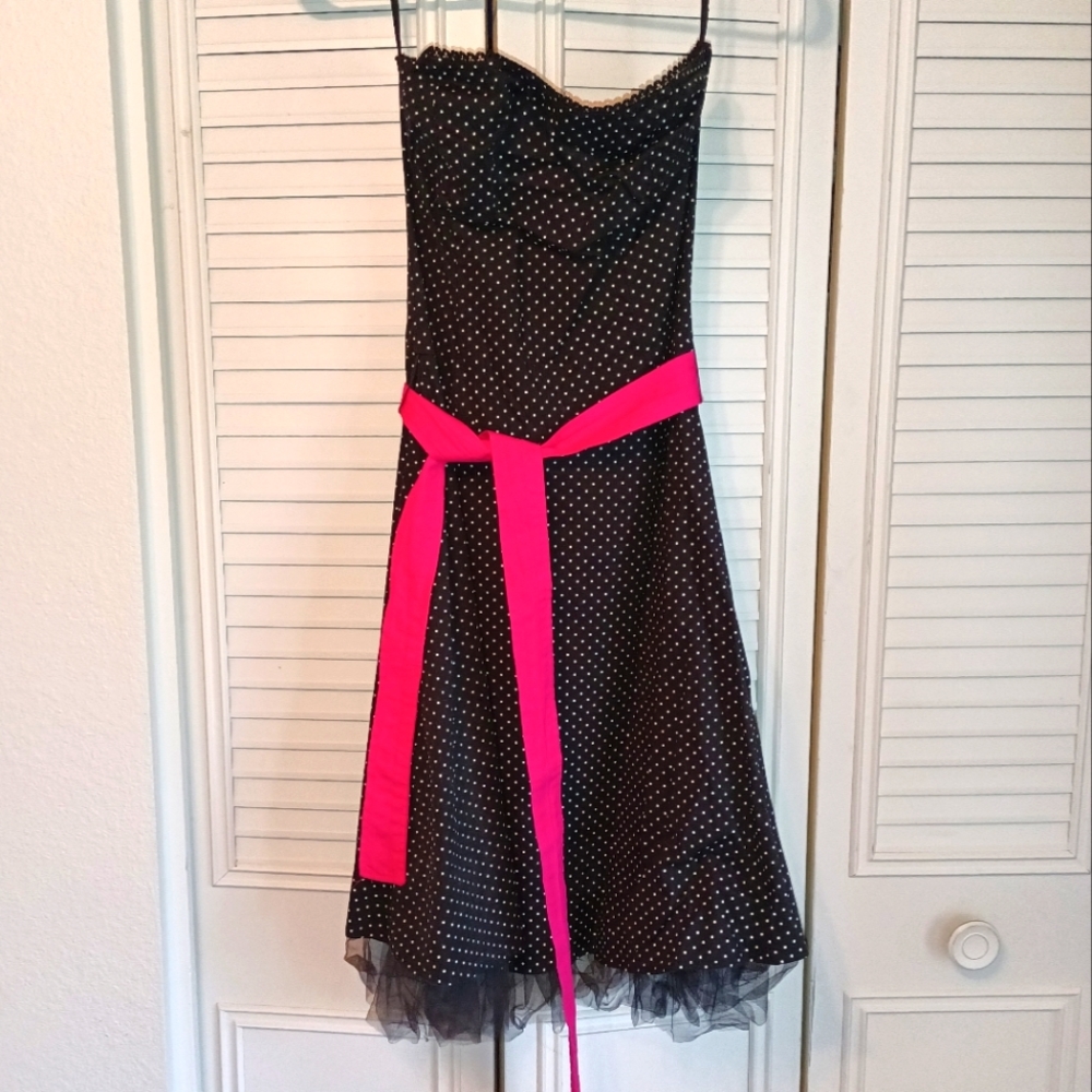 Cute poka-dot dress with bright pink waist tie